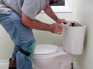 Plumbing contractor in San Bruno repairs a toilet's ballcock assembly